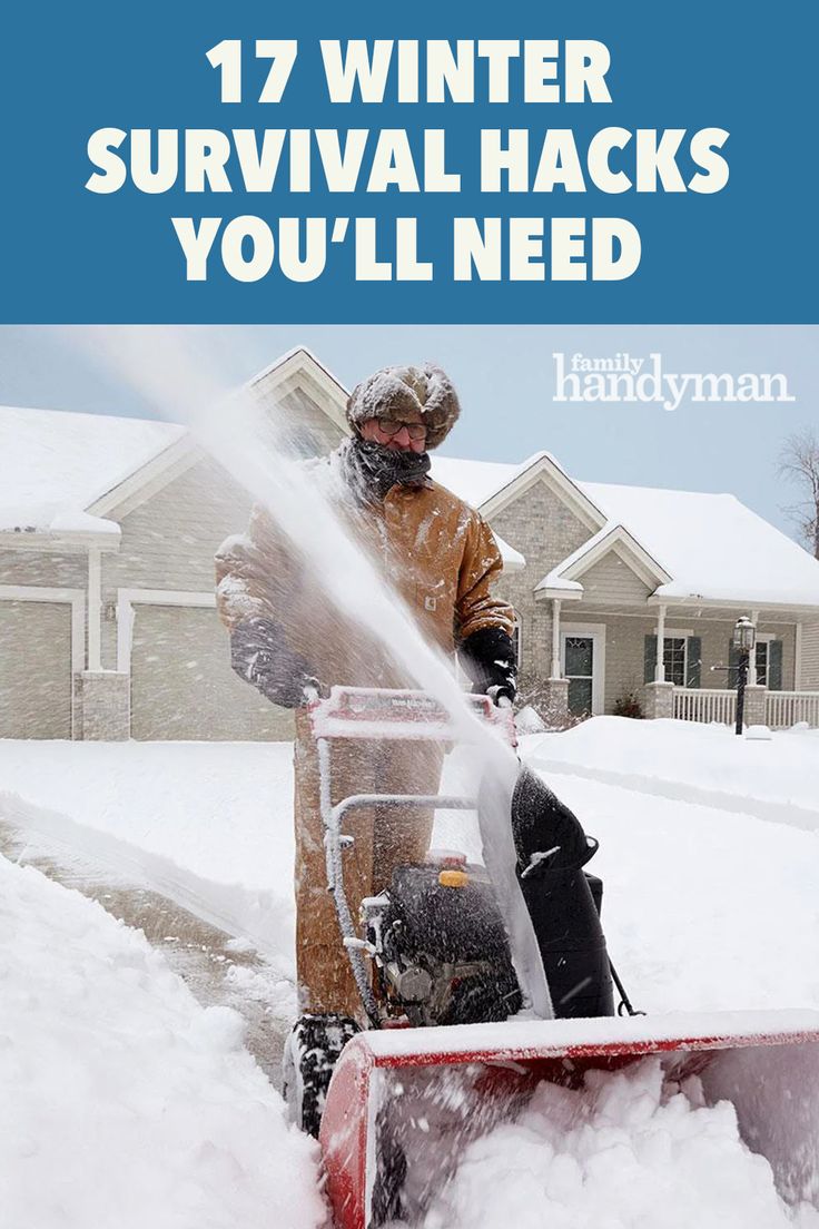 a man using a snow blower to clear the snow