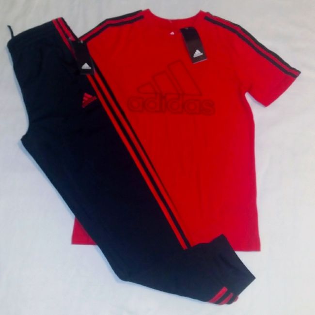 Brand New Never Worn With Tags. Adidas Set Includes A Red Short Sleeve Cotton Blend Tee Top With Classic Adidas Inscription On Front In Black And 3 Stripes Down Each Sleeve. Bottoms Are Black Polyester Blend Pocketed Design With Elastic Waistline And Classic Adidas 3 Pale Logo And Inscription On Left Leg With Banded Leg Opening And 3 Red Stripes Down Each Outer Leg. Set Fits Medium Boys Youth (10-12 Years). Any Questions, Please Contact Me. Thanks! Cotton Sport Sets With Graphic Print, Cotton Graphic Print Sports Sets, Cotton Crew Neck Sportswear Sets, Cotton Sports Sets With Short Sleeves, Cotton Sportswear Set With Crew Neck, Short Sleeve Cotton Sports Set, Casual Red Crew Neck Sets, Casual Red Sets For Streetwear, Casual Red Stretch Sets