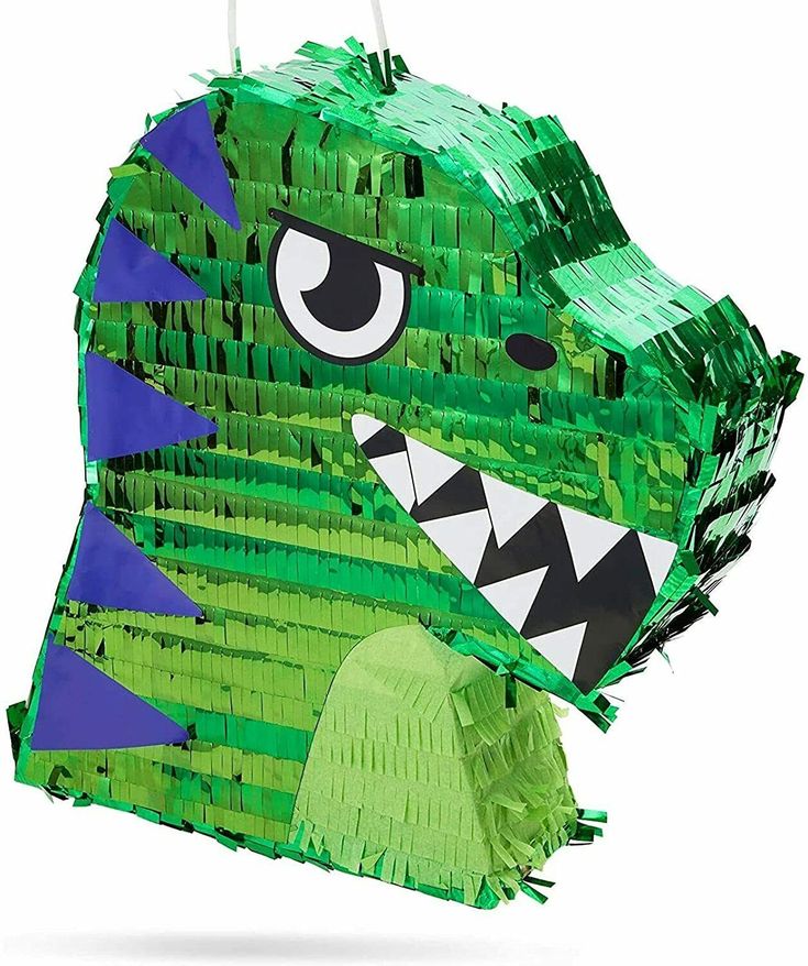 a green and blue paper bag with a large monster face on it's side