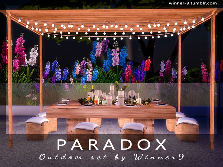 a wooden table with white chairs under a lit up gazebo surrounded by purple flowers