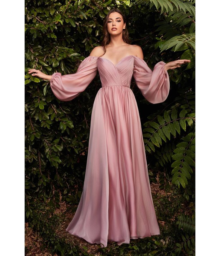 This breathtaking gown is crafted in a stunning petal blush chiffon fabric that floats over a matching lining. The sweetheart bodice features pleating throughout, and is framed with sheer long sleeves, while the dramatic full length skirt boasts a small train.Please allow a 2-3 day handling time. Available in sizes 6-24 while supplies last. . Aesthetic Dresses Formal, Atlas Dress, Oc Clothes, Long Sleeve Bridesmaid Dress, Sweetheart Bridesmaids Dresses, Gown Ideas, Long Sleeve Chiffon Dress, Cinderella Divine, Perfect Bridesmaid Dress