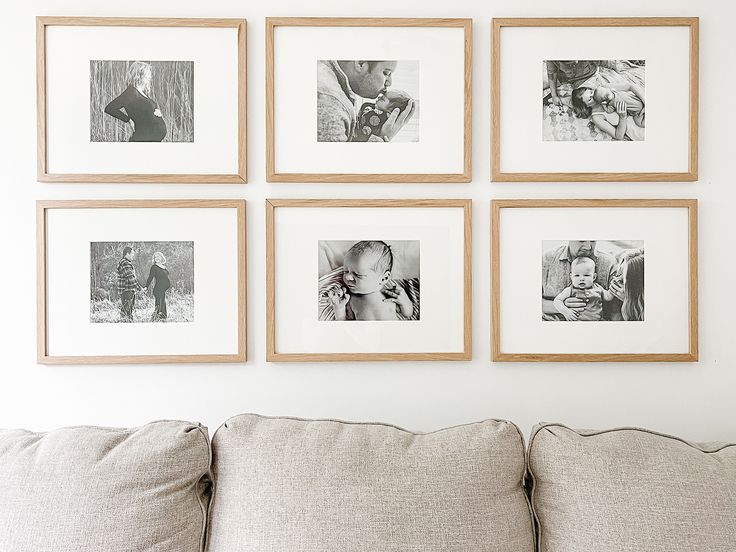 six framed photographs hang on the wall above a couch