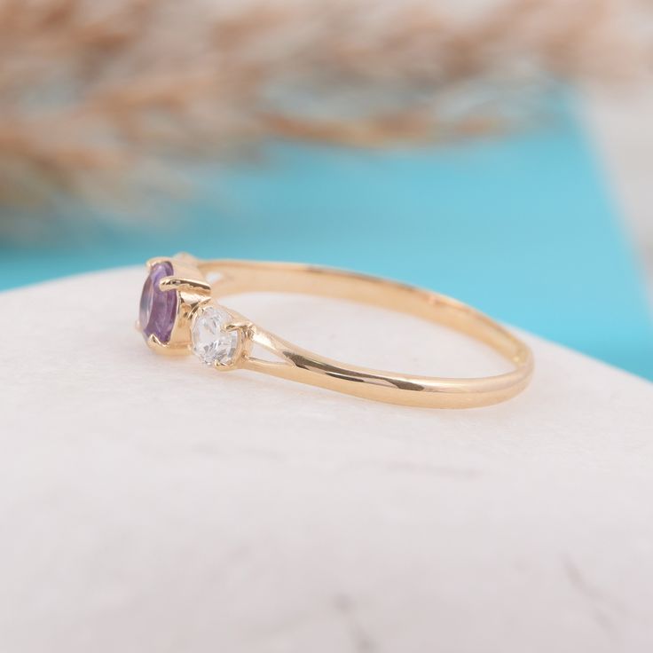 "Womens dainty 3 stone setting amethyst engagement ring, Simple 14k yellow gold amethyst promise ring for her, Amethyst womens wedding ring WE OFFER UNLIMITED PERIOD INSTALLMENTS PLAN This is a beautiful, stunning, feminine ring that works well for all occasions, styles, and ages. You will love it! Ring information Main stone: Amethyst Approximate size: 4.5mm Accent stone: Cubic zirconia Approximate size: 3mm Metal type: Gold Metal stamp: 14k solid gold Customization / Replacements It's easy to Purple 14k Gold Birthstone Wedding Ring, Fine Jewelry Three Stone Amethyst Ring For Wedding, Purple Dainty Birthstone Promise Ring, Round Amethyst Three Stone Promise Ring, Round Three Stone Amethyst Promise Ring, Elegant Three Stone Amethyst Promise Ring, Round Three-stone Amethyst Promise Ring, Purple Birthstone Ring In 14k Gold For Promise, Amethyst Three Stone Promise Ring