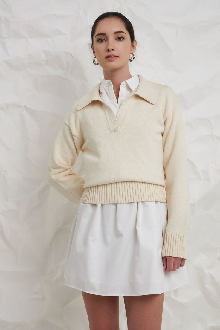 A soft and comfortable sweater to take you through the seasons. The breathable knit fabric means you can wear this ivory sweater on its own with shorts during warmer months, or you can layer it and style it with your favorite trousers when it's cold. A classic silhouette, you can pair this sweater with all of your favorite bottoms. For a comfortable and casual look, wear this sweater with some high-waisted jeans and your favorite sneakers. Knit Collar Drop shoulder V neckline Long sleeves Ribbed Ivy Clothing, Casual Party Dresses, English Factory, Knit Outerwear, Ivory Sweater, Balloon Sleeve Blouse, Comfortable Sweater, Soft Classic, Collar Sweater