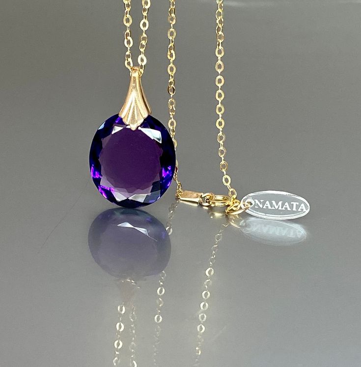 Gorgeous sparkly Amethyst pendant necklace. The purple Amethyst pendant is eye-clean and reflects lights beautifully. The oval faceted pendant is attached to a gold-filled bail and suspended on a 14k gold fill chain. The necklace is elegant and has a lux look. * AAA+ Flawless Amethyst (21ct) * Pendant size(with the bail): 30x18 mm * Metal: 14K gold-filled * Necklace length : 46 cm / 18 inc Solid gold, 14K gold-filled, sterling silver are my materials of choice, I love working with these beautifu Elegant Purple Oval Pendant Necklace, Purple Gemstone Oval Pendant Necklace, Purple Gemstone Necklace With Oval Pendant, Faceted Oval Purple Jewelry, Elegant Faceted Purple Crystal Necklace, Elegant Purple Faceted Crystal Necklace, Purple Oval Gemstone Necklace, Purple Oval Pendant Birthstone Jewelry, Purple Amethyst Oval Pendant Jewelry