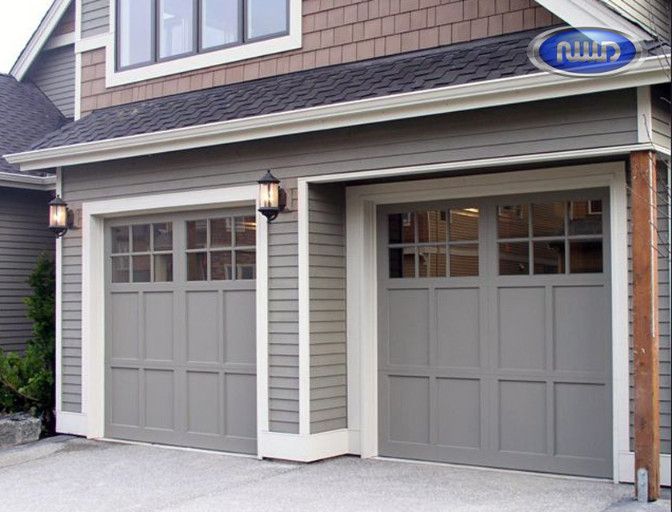 two garages in front of a house with windows and doors on either side of them