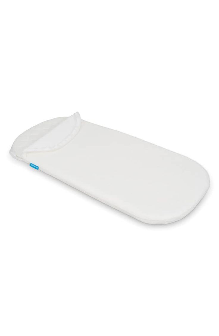 a white baby changing pad on a white background