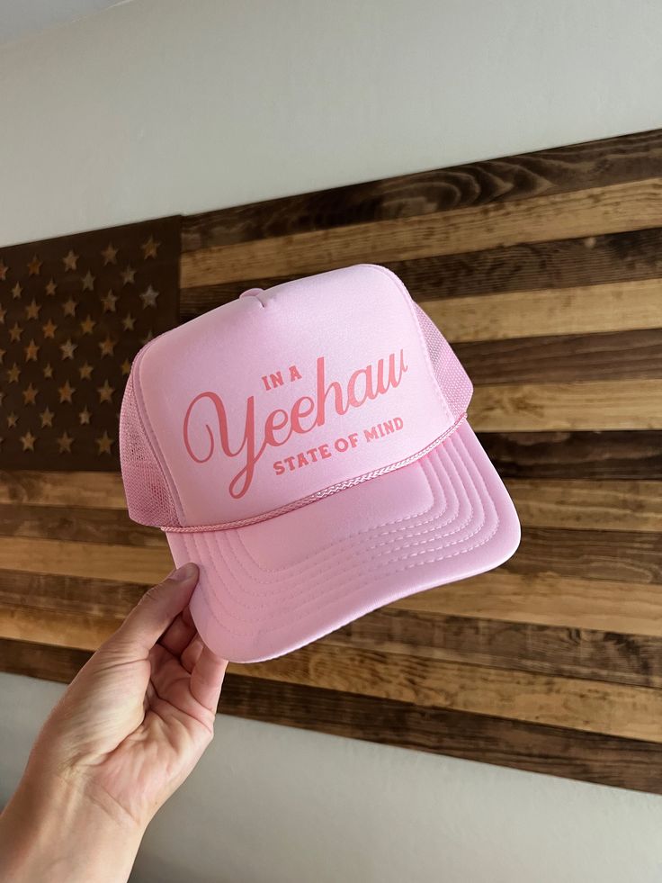 "*TAN OPTION IS OUT OF STOCK* Light pink  snap back high crown foam trucker hat detailed with coral pink \"In a Yeehaw State of Mind\" graphic." Pink 5-panel Snapback Hat, Pink Snapback Trucker Hat, Pink Flat Brim Trucker Hat, Pink Adjustable 5-panel Trucker Hat, Pink Trucker Hat With Curved Brim, Pink Trucker Cap, Pink Curved Brim Trucker Hat, Fun Pink 5-panel Trucker Hat, Pink Trucker Baseball Cap With Flat Brim