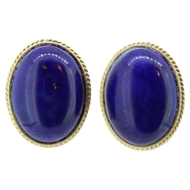 Vintage from the 1990s Materials: Gold Location: Earlobe About this item Beautiful and Unique Earrings. Coiled Cable outline around a Lapis Lazuli oval cabochon. 14k Gold. Yellow Gold Details: 12mm by 16mm lapis 4.9grams total Stud Gold Earrings, Lapis Lazuli Earrings, Lapis Lazuli Ring, Blue Lapis Lazuli, Cabochon Ring, The 1990s, Blue Lapis, Yellow Gold Earring, Large Earrings