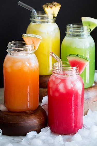 three different colored drinks in mason jars