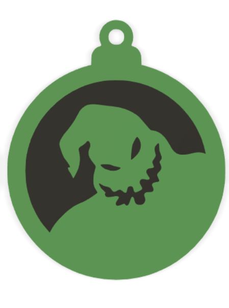 a green ornament with an image of a dog's head