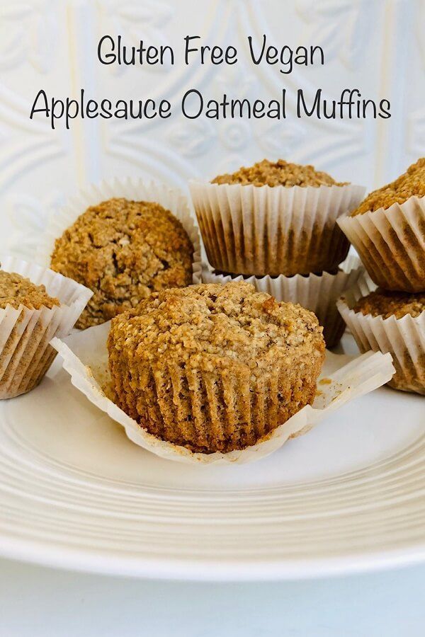 some muffins are on a white plate with the words gluten free vegan applesauce oatmeal muffins