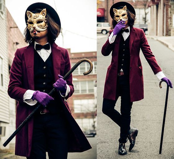 two pictures of people wearing masks and holding canes, one with a cat mask on it