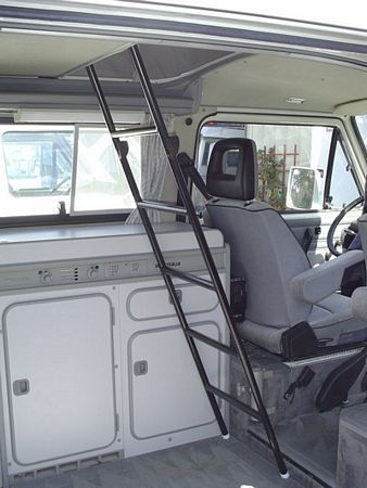 the interior of a vehicle with ladders to go up and down it's side