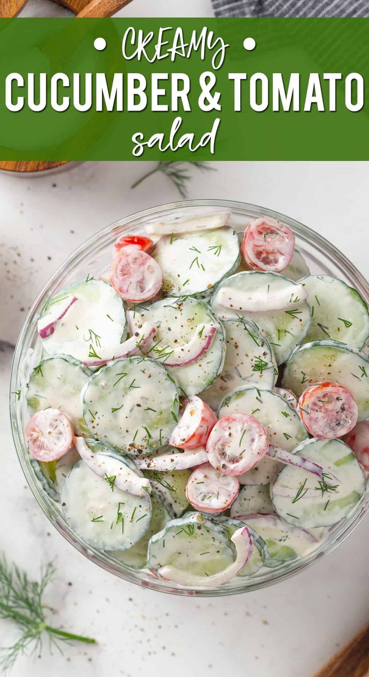 a bowl filled with cucumber and tomato salad on top of a white counter