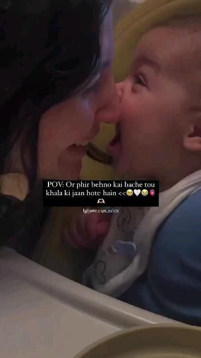 a woman holding a baby and kissing it's face with the caption, pov or phih behind her