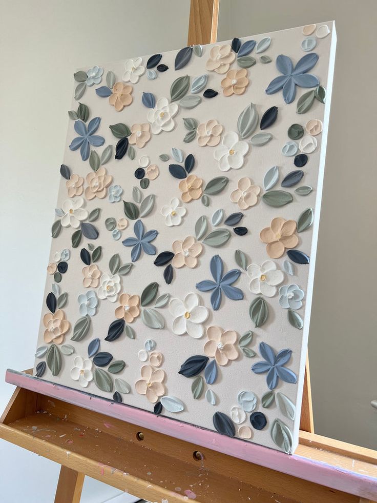 a painting is being displayed on an easel