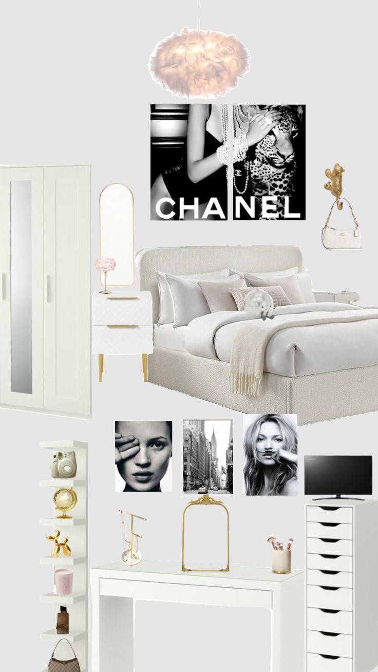 a white bedroom with chandelier and pictures on the wall