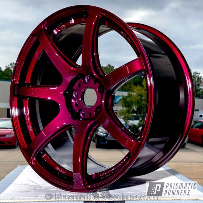 a close up of a red wheel on display