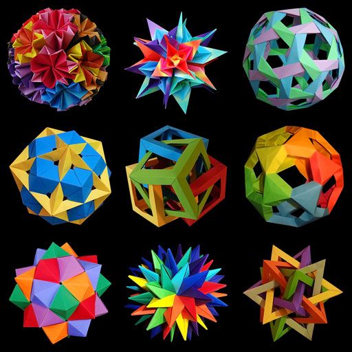 six different types of origami balls in various colors and shapes on a black background