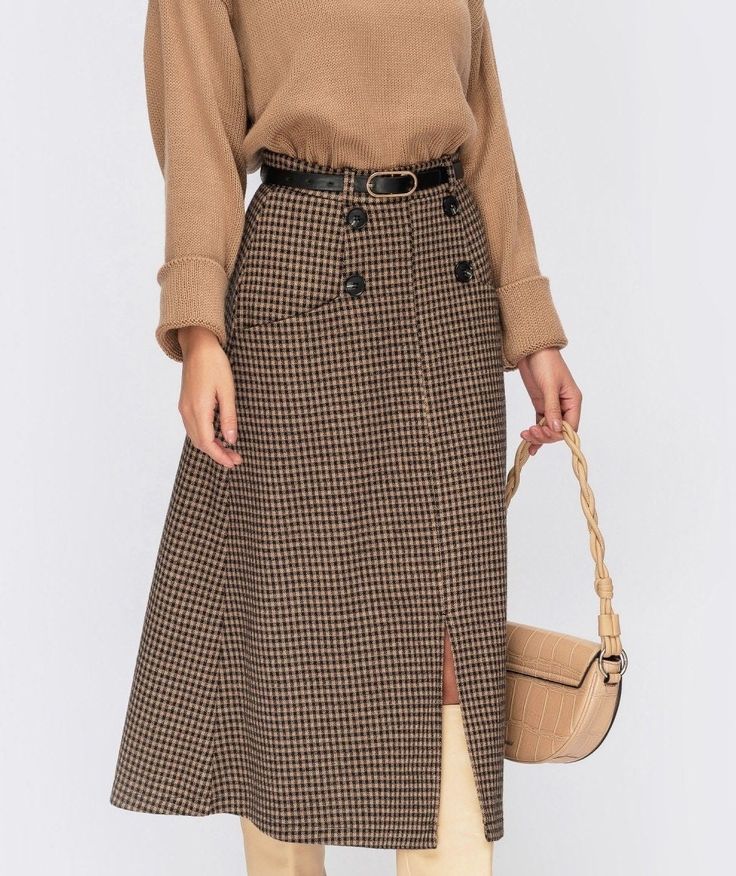 "Plaid jacquard midi-length skirt. Model with pockets, decorative buttons and front slit. Fastens with a hidden zipper. Fabric: 35% wool, 35% viscose, 30% polyester Skirts length 77 cm chest waist hip XS: 84cm 64cm 88cm (33\") (25\") (34.6\") S: 88cm 68cm 92cm (34.6\") (26.7\") (36.2\") M: 92cm 72cm 96cm (36.2\") (28.3\") (37.8\") L: 96cm 76cm 100cm (37.8\") (29.9\") (39.4\") XL: 100cm 80cm 104cm (39.4\") (31.5\") (40.9\") 2XL: 104cm 84cm 108cm (40.9\") (33.1\") (42.5\") 3XL: 108cm 88cm 112cm (4 Elegant Long Skirt Outfits, Brown Wool Skirt Outfit, Wool Skirt Outfit, Cozy Skirt, Warm Skirt, Warm Skirts, Office Clothing, Maxi Skirts Summer, Below The Knee Skirt