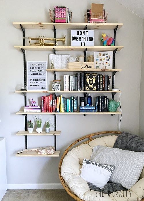 the bookshelf is filled with lots of books and other things to read on it