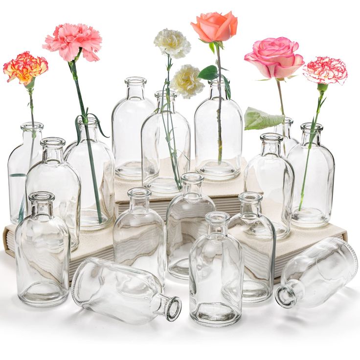 PRICES MAY VARY. YOUEON set of 16 living bud vase measure 5.1"H x 2.4"D, bud bottles have a thin neck and sturdy base to stand well and easily being held. Sufficient quantities are enough to meet your need. Wide range of uses: This glass vase set can be used for long-stemmed flowers or as centerpieces for home decorations, farmhouse home decor, table decor, wedding, party, hotel, restaurant, cafes. It can also be used as an alternative to diffuser bottles and diffuser containers, put in essentia Milk Bottle Flowers, Bud Vase Centerpiece, Office Table Decor, Glass Vases Centerpieces, Long Stem Flowers, Bottle Centerpieces, Glass Flower Vase, Table Centerpiece Decorations, Flower Bottle