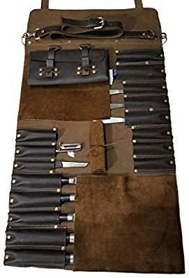 a brown and black bag filled with lots of different types of knives on top of it