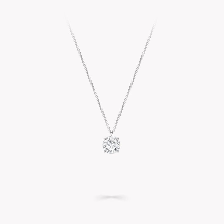 There is incredible elegance in the purest of designs. Our round diamond pendant from the Classic Graff collection is the epitome of pared-back classicism. Selected by a member of the Graff family for their superlative quality, diamonds this beautiful need no further ornamentation to capture the attention. Featuring a round diamond, suspended from a fine platinum chain, this is the ultimate day-to-night jewel for those who appreciate timeless design and flawless handcraftsmanship. Model wears an Formal Solitaire Necklace With Single Cut Diamond Pendant, Formal White Diamond Necklace With Round Stone, Formal Solitaire Necklace With Single Cut Diamonds, White Diamond Necklace With Round Stone For Formal Occasions, Refined Brilliant Cut Round Diamond Necklace, Classic Pendant Diamond Necklace With Single Cut Diamonds, Formal Round Pendant Diamond Necklace With Brilliant Cut, Elegant Round Pendant Diamond Necklace With Brilliant Cut, Formal Diamond Necklace With Brilliant Cut Round Pendant