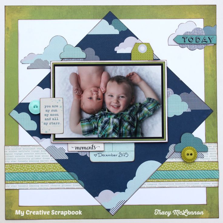 a scrapbook page with an image of two babies