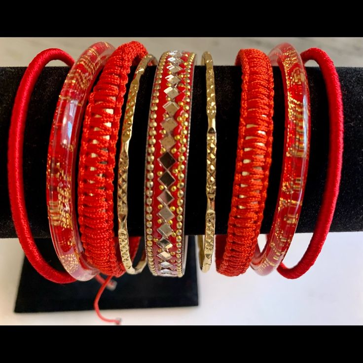 Nwot Gorgeous Red Bangle Bracelet Set. This Nine Piece Set Is A Real Show Stopper. They Are Gorgeous Reds And Gold. You Can Wear Them All At Once Or Just A Few At A Time. They Are Mixed Media Adding An Extra Level Of Texture And Fashion. These Are Very Unique. You Can Dress Them Up By Adding Some Cz Bangles, Pair Them With Other Colors, Or Wear Them As They Are. They Are Very On Trend And The Colors Are Stunning. Red Beaded Bracelets As Festival Gift, Red Beaded Bracelets For Festivals, Red Adjustable Jewelry For Celebration, Adjustable Red Jewelry For Celebration, Adjustable Festive Bracelets, Handmade Red Bracelets For Celebration, Adjustable Red Jewelry For Festivals, Red Traditional Bracelets For Festival, Red Bohemian Bracelets For Celebration