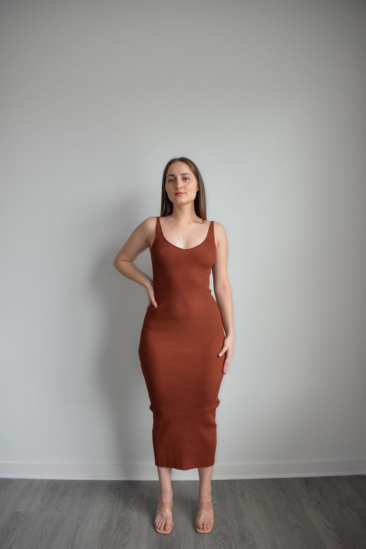 Step up your casual style with our Chic Knit Maxi Dress - Brick. This dress features a warm brick color and soft knit fabric, perfect for brunch with friends, casual weekend outings, or daytime strolls. The maxi length offers a flattering silhouette for effortless elegance. Upgrade your wardrobe with this versatile piece! Elevate any look with the classic style of the Brick knit Maxi Dress. Crafted from ribbed knit fabric, this sweater dress features a sleeveless design, low back neckline detail Solid Maxi Dress For Fall Brunch, Solid Color Maxi Dress For Fall Brunch, Everyday Fitted Fall Dresses, Casual Solid Ribbed Midi Dress, Everyday Fitted Dresses For Fall, Fitted Everyday Dress For Fall, Fitted Dresses For Everyday Fall Wear, Casual Brown Stretch Maxi Dress, Casual Knit Midi Dress For Loungewear