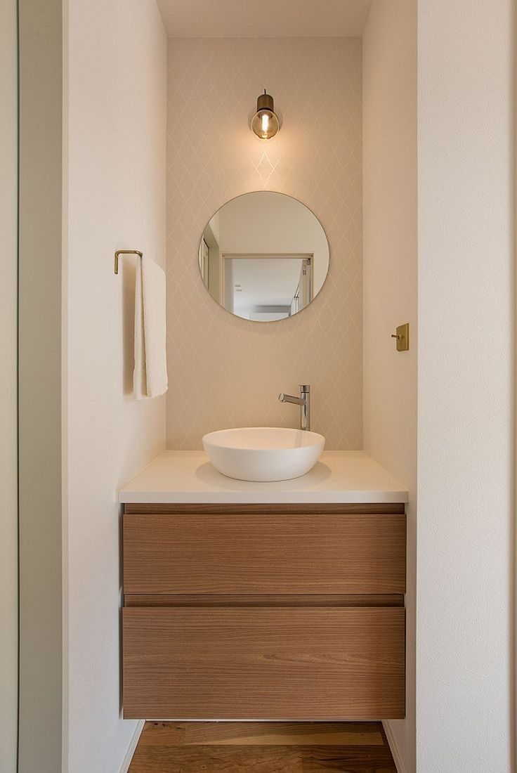 a bathroom with a sink and mirror in it