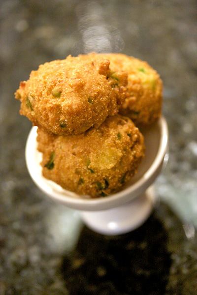 three fried food items in a small white bowl