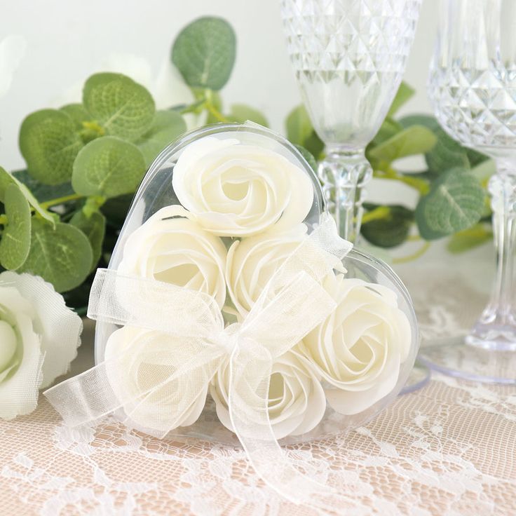 some white flowers sitting on top of a table