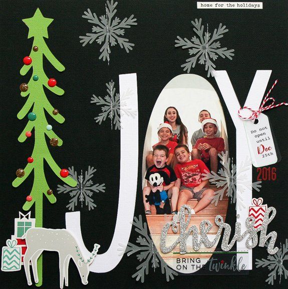 a scrapbook page with the word joy on it and an image of christmas trees