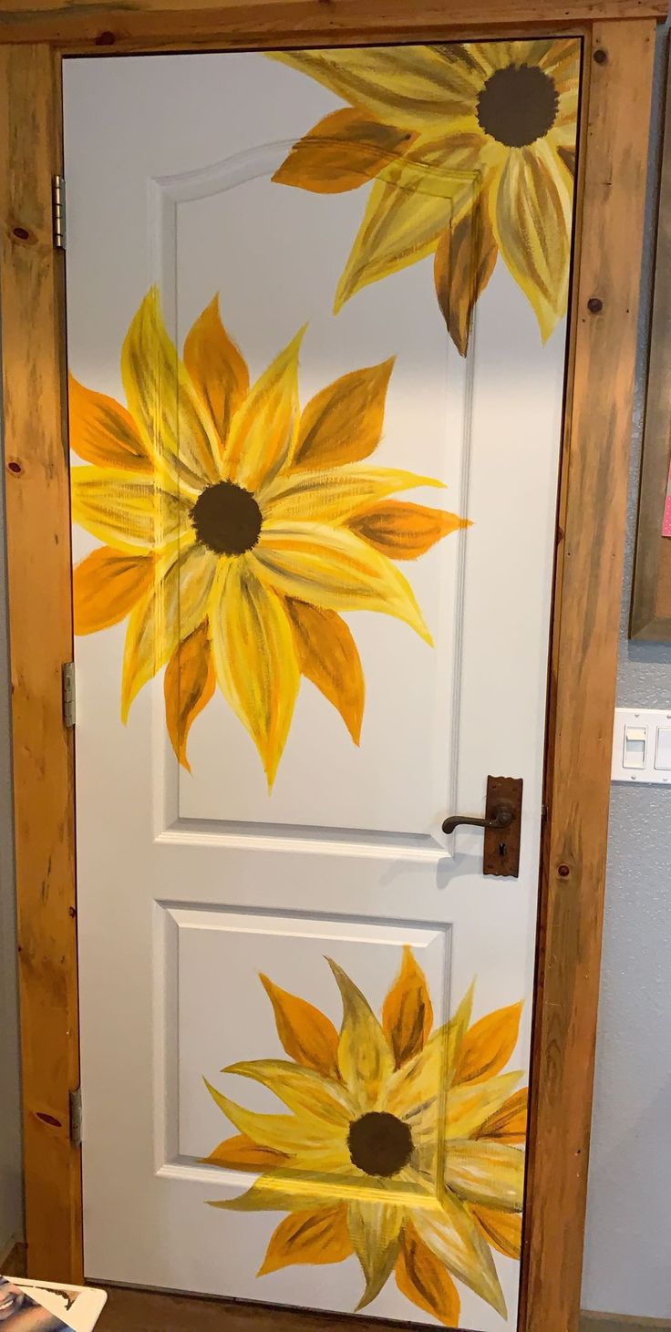 the door is painted with sunflowers on it