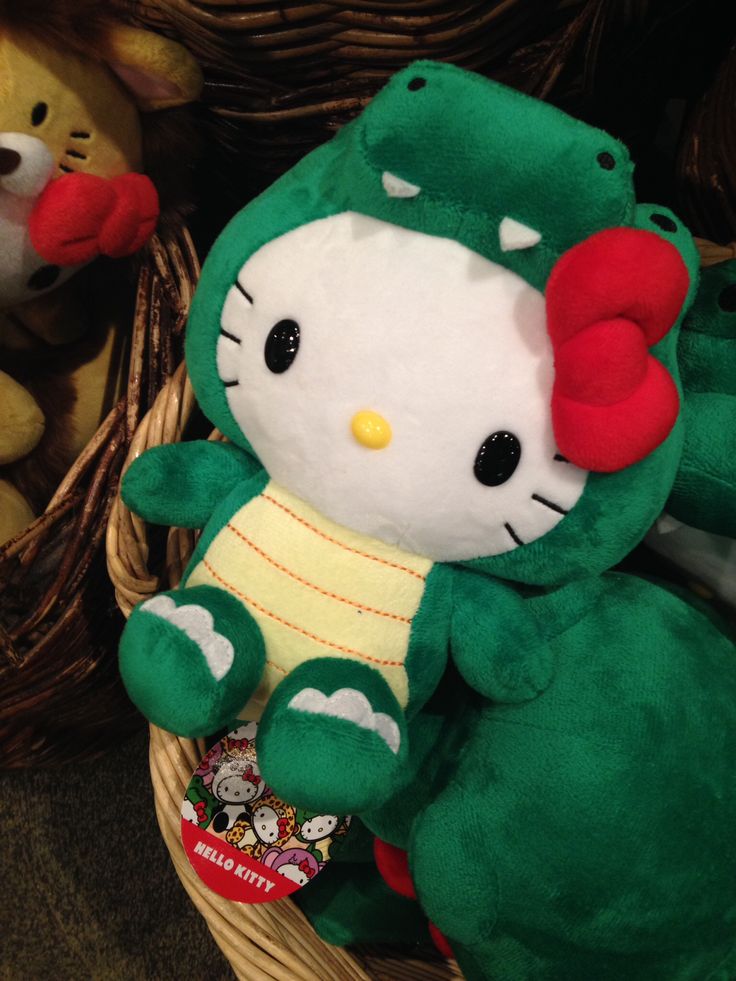 a hello kitty stuffed animal sitting in a basket