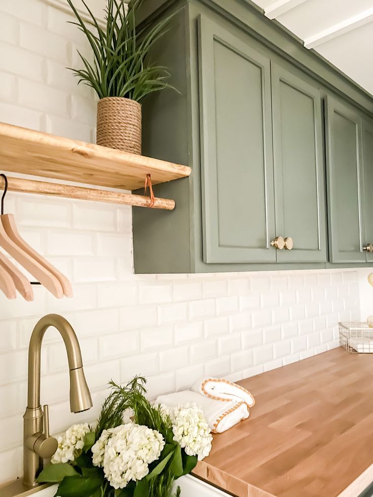 the kitchen counter is clean and ready to be used as a planter for flowers