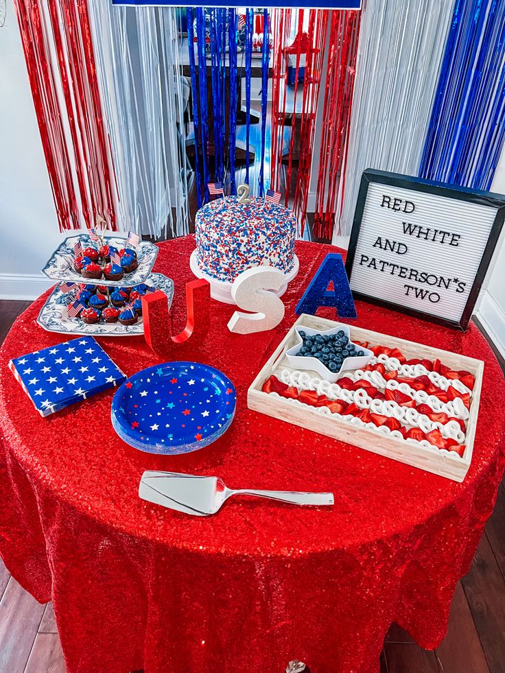 red, white and blue desserts on a table at a patriotic themed birthday party