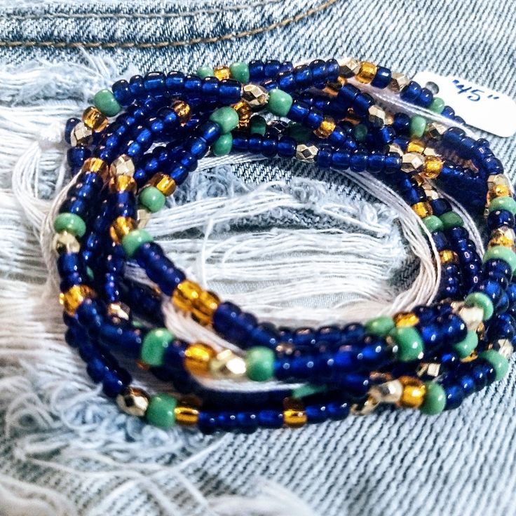 "45" Hand Beaded Royal Blue,Green And Gold 6/0 Glass Seed Beads. Strung On 100% Mercerized Cotton. Blue Beaded Chain Bracelets For Beach, Blue Round Beads Waist Beads For Gift, Blue Beaded Bracelets For Summer Festival, Blue Waist Beads Gift, Blue Beaded Bracelets For Festivals With Round Beads, Blue Waist Beads With Spacer Beads As Gift, Blue Bracelets With Tiny Beads For Parties, Blue Colorful Waist Beads As Gift, Blue Spacer Beads For Festivals