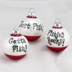 three red and white ornaments with words on them