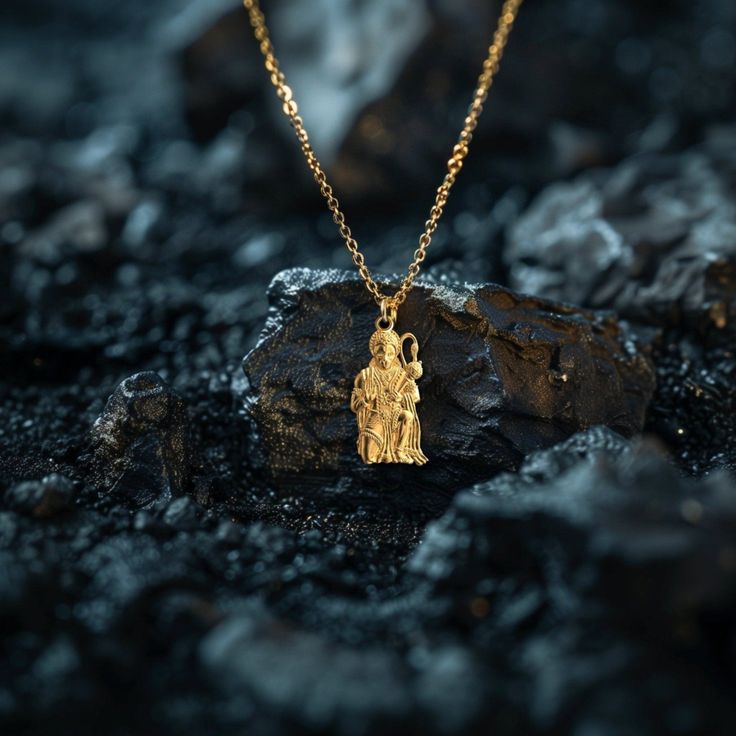 Elevate your faith with our gold Hanuman Pendant, symbolizing devotion and strength in Hinduism. This solid gold Hanuman necklace captures the essence of the Monkey God. Explore our collection of Hanuman-themed jewelry, including elegant gold medallions, perfect for those seeking a unique and meaningful piece of Hindu faith. PENDANT INFORMATIONThis pendant is made of real, solid gold.• Made in USA• Material: 14k or 18k solid gold• Finish: polished• Height: 1.29" (32,5 mm) x Width: 0.67" (17 mm)• Pendant weight: approx. 6 grams (14k)• Bail: fits up to 4 mm chains• Solid back, not hollow• A certificate of authenticity is included• Delivered in our elegant jewelry box, making it the perfect gift Shipping: All of our orders are custom-made. Please allow approximately 3 weeks for production and Gold Hanuman, Hanuman Pendant, Phoenix Pendant, Gold Dragon, Gold Medallion, Gold Tree, Lord Hanuman, Solid Gold Chains, Mini Pendants