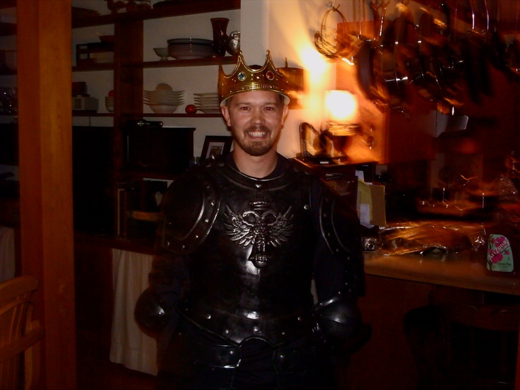 a man dressed up as a knight in a kitchen