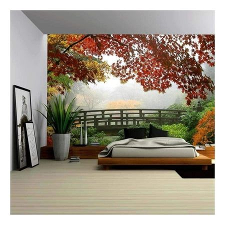 the bedroom is decorated in autumn colors and has a large bed with pillows on it