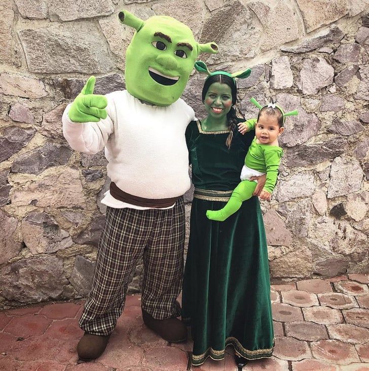 two children and an adult in costume posing for a photo with the shrap