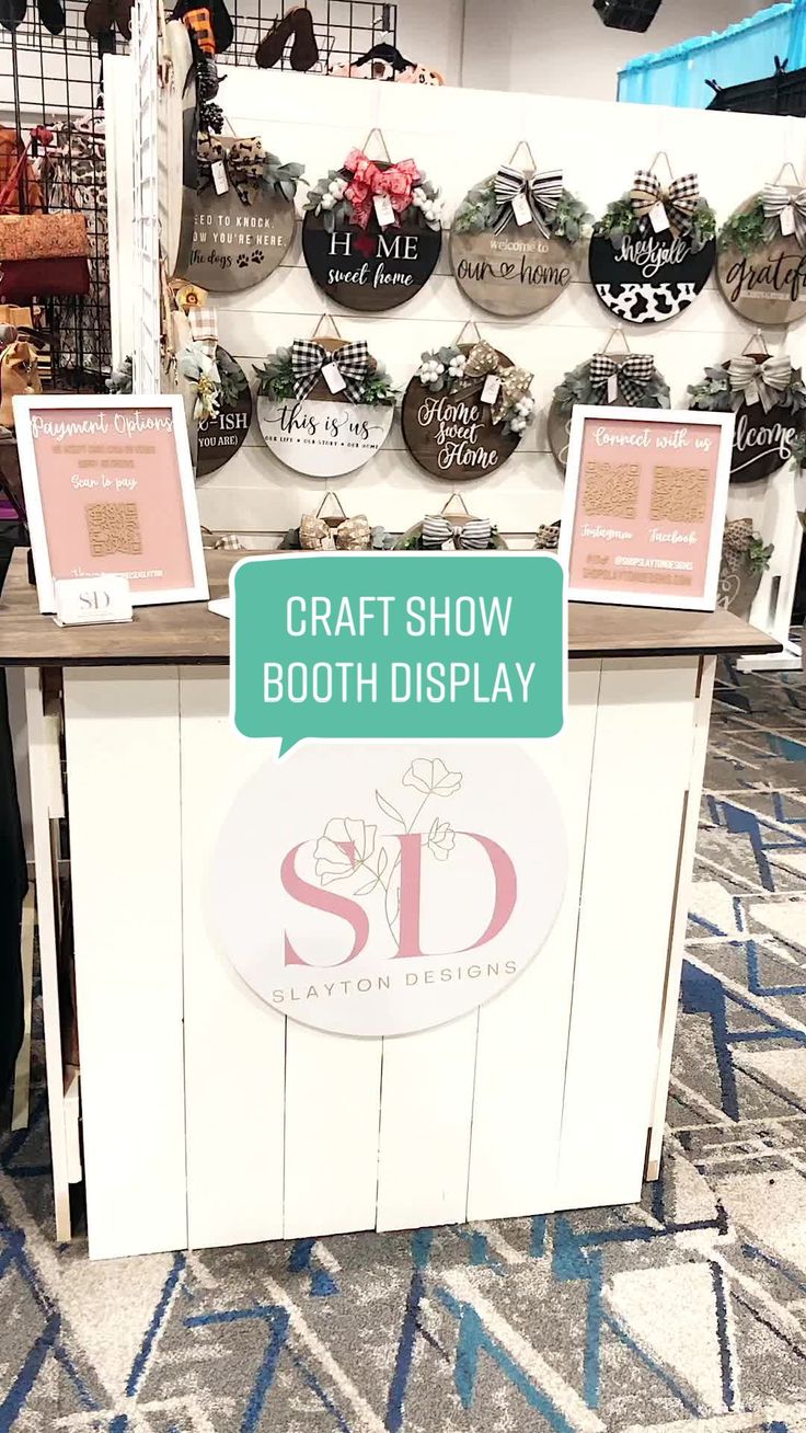 a booth at a craft show with signs on it