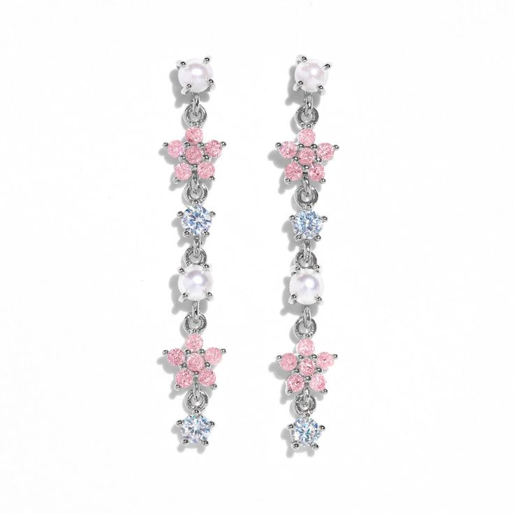 Elevate your ensemble with the alluring design of our Pearl Petals Dangle Earrings. Inspired by the graceful movements of dancers, this ethereal design captures the essence of femininity and elegance. With intricately crafted petals and a touch of blush, these earrings are a celebration of timeless beauty. Elegant Pink Flower Earrings In Sterling Silver, Elegant Pink Sterling Silver Flower Earrings, Delicate Crystal Dangle Earrings, Flower Shaped Chandelier Earrings, Silver Feminine Flower Earrings For Formal Occasions, Feminine Dangle Earrings For Evening, Feminine Evening Dangle Earrings, Pink Flower Earrings For Evening, Feminine Dangle Flower Earrings