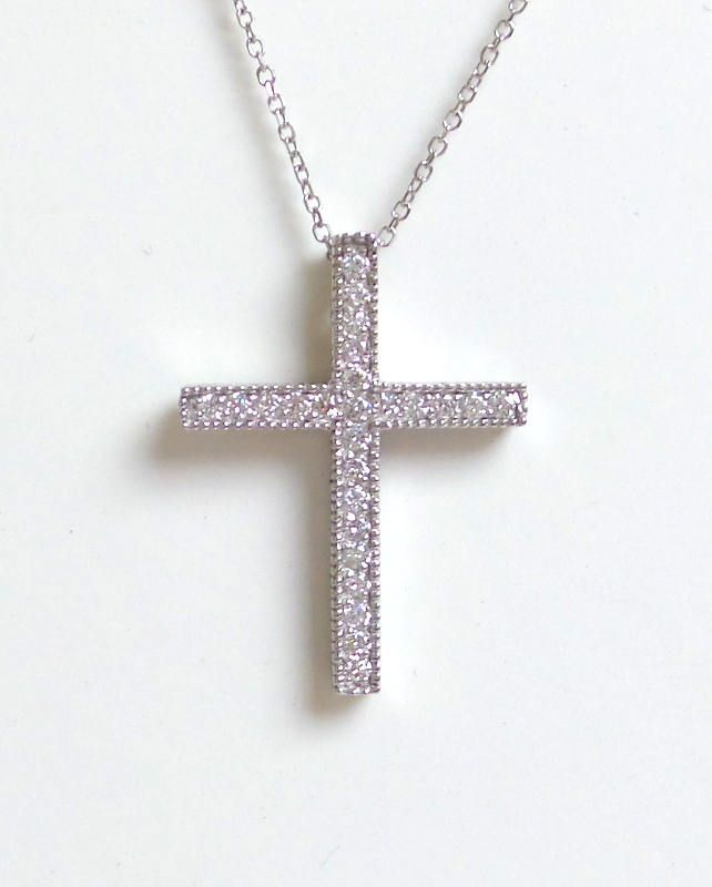 DIAMOND CROSS/ 14K GOLD DIAMOND CROSS/ GOLD DIAMOND CROSS/ VINTAGE DIAMOND CROSS/ RELIGIOUS GIFT / BIRTHDAY GIFT / CHRISTMAS GIFT/ WHITE GOLD DIAMOND CROSS / CONFIRMATION GIFT FREE SHIPPING WITHIN THE USA 14 KARAT SOLID WHITE GOLD AND DIAMOND CROSS NECKLACE. THE CHAIN IS ALSO 14K SOLID WHITE GOLD. I HAVE IT IN 14 INCHES THROUGH 18 INCHES. THE DIAMONDS ARE NATURAL ALL HAND PICKED AND SET 0.35 CTS SI1 CLARITY G COLOR. THE DESIGN IS AN OLD TECHNIQUE WE USE . THE DIAMONDS ARE FRAMED WITH A MILLGRAIN Gold Platinum Necklace Gift, Silver Brilliant Cut Cross Pendant Jewelry, Pave Setting Cross Necklace For Gift, Cross Necklace With Pave Setting For Gift, Cross Necklace With Pave Setting As Gift, Gold Platinum Necklace With Vvs Clarity, Luxury Diamond Cut Cross Jewelry, Silver Necklace With Pave Setting In 14k Gold, Silver Cross Jewelry With Brilliant Cut