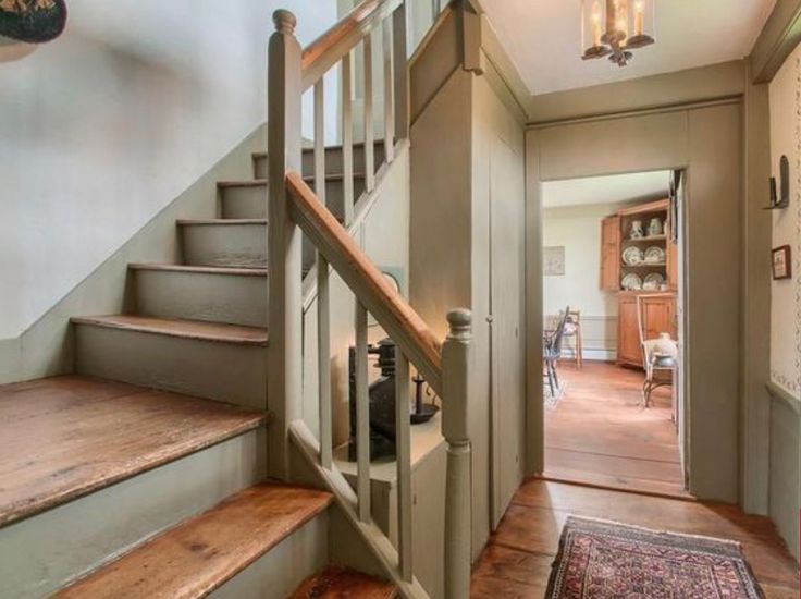 an entry way leading to a living room and dining room